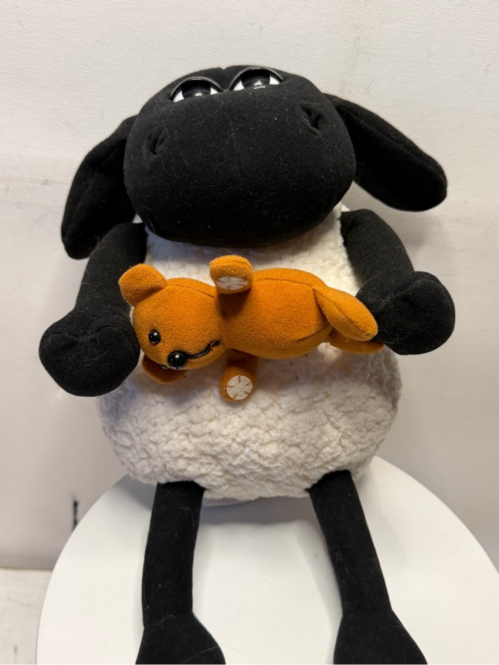 Plush Black & White Sheep Holding Orange Bear - Cute Decorative Stuffed Animal
